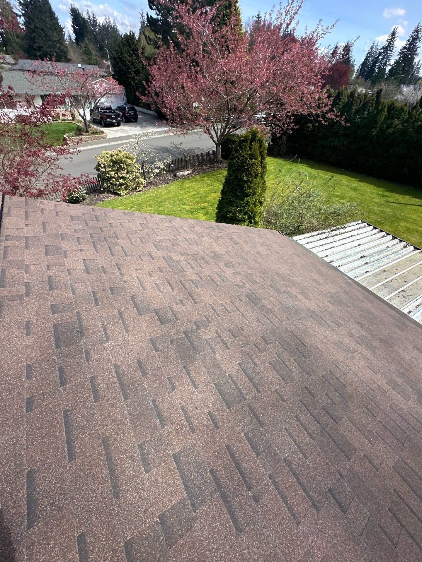 Aerial drone view of completed Antique Brown asphalt shingle roof on Everett, WA home by Amor Roofing