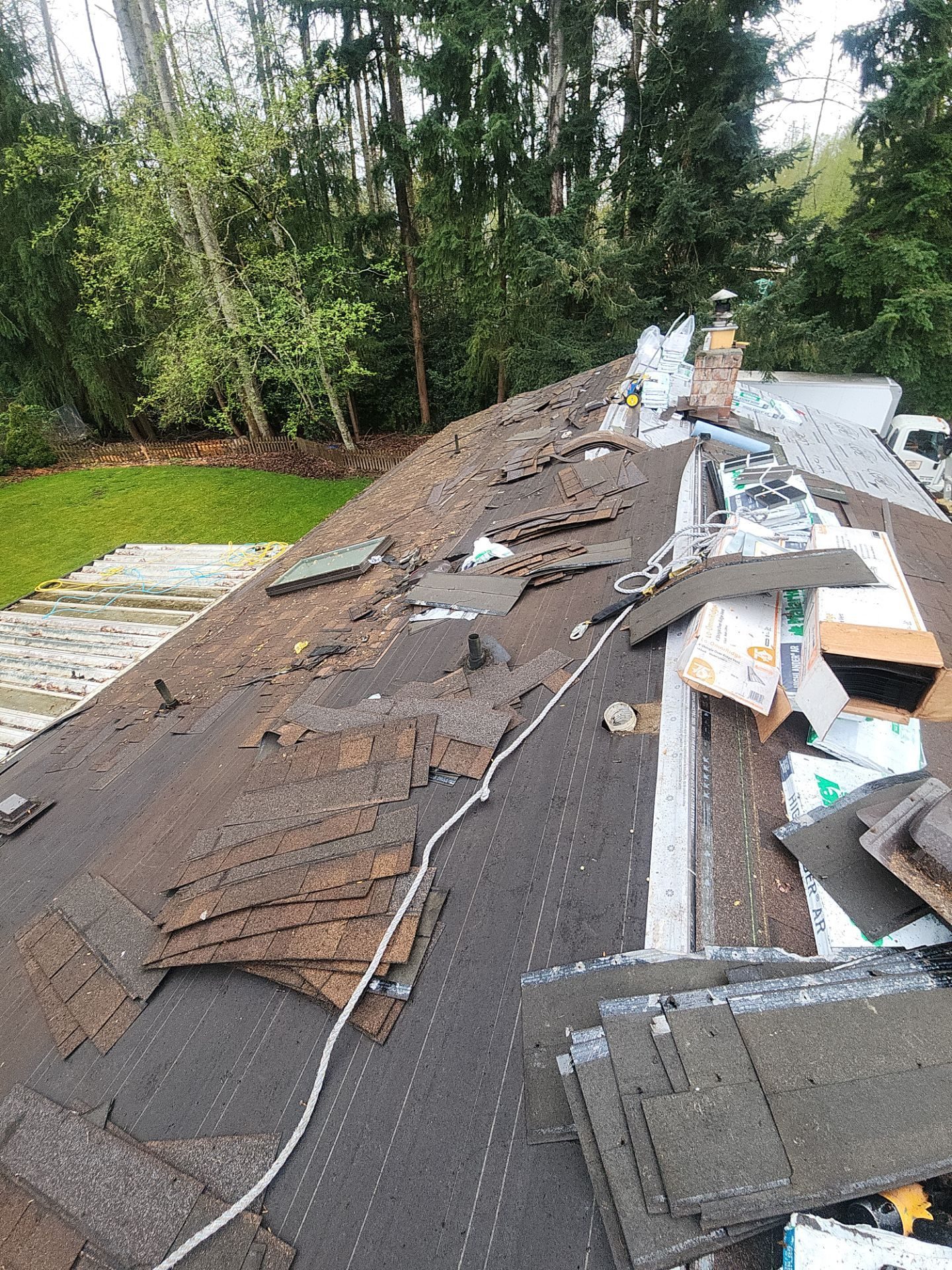 Mid-installation view during Antique Brown asphalt shingle roof project in Everett, WA
