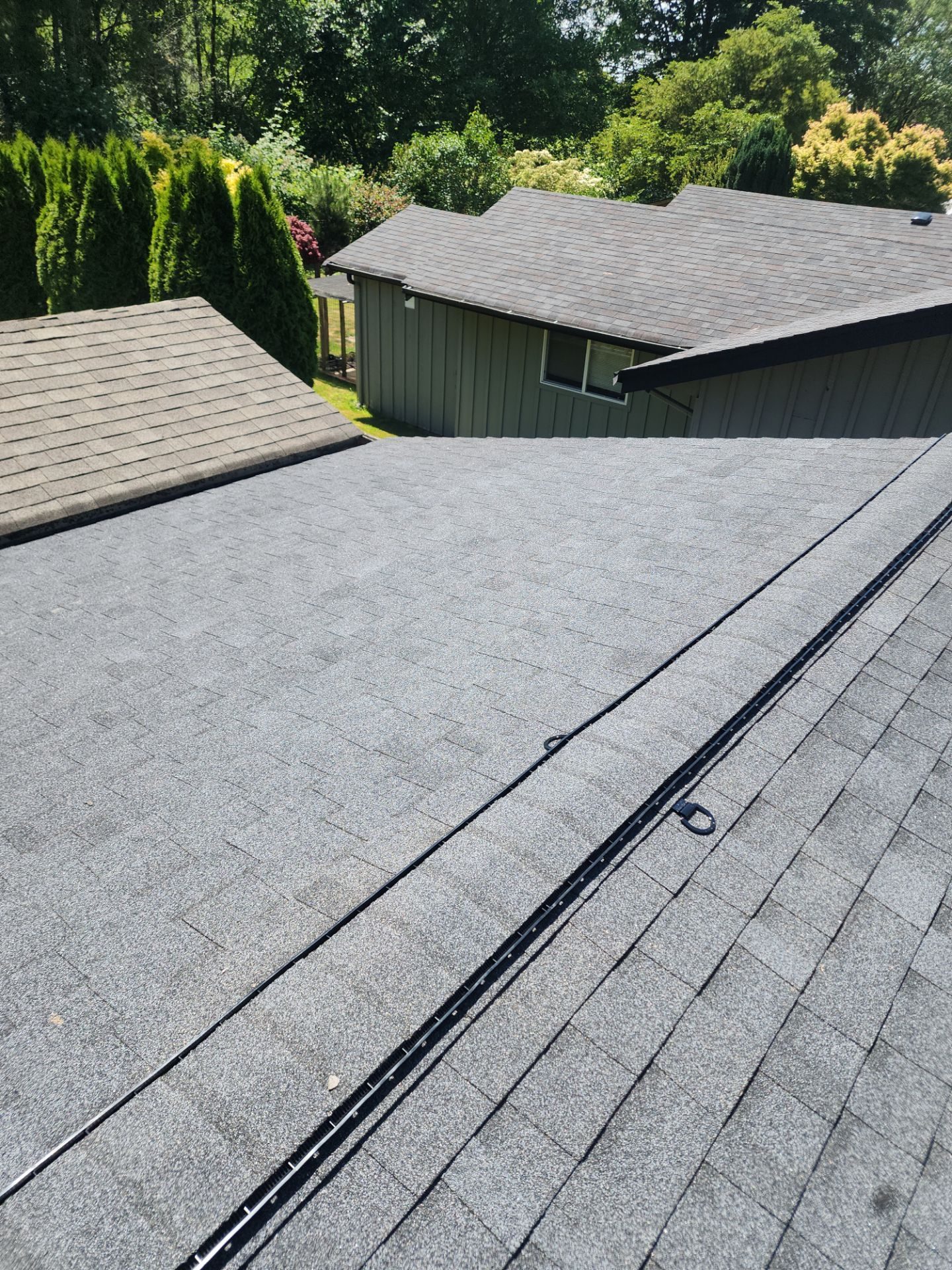 Aerial drone view of completed Heather Grey asphalt shingle roof on Lake Stevens, WA home by Amor Roofing