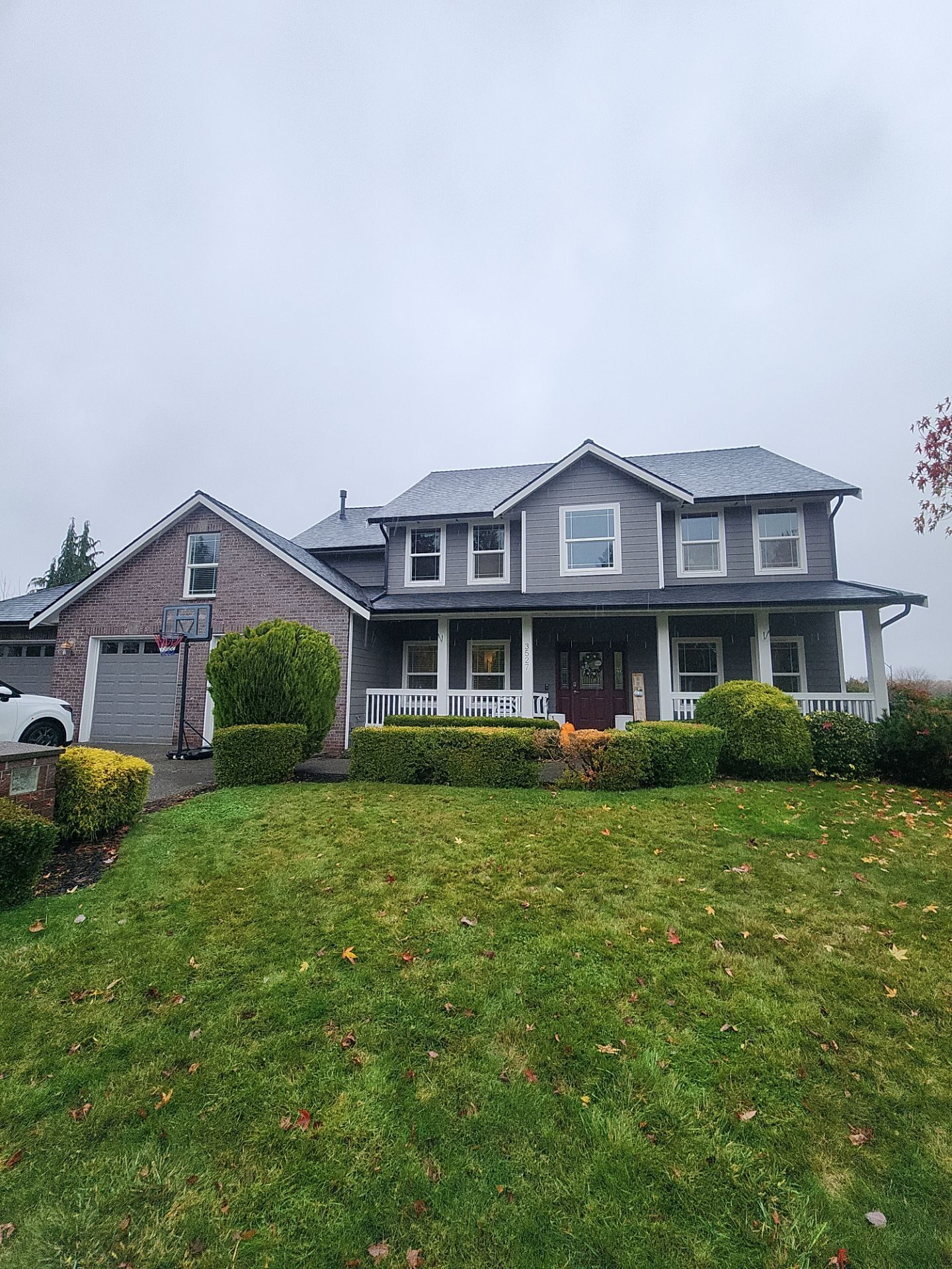Aerial drone view of completed Midnight Black asphalt shingle roof on Snohomish, WA home by Amor Roofing