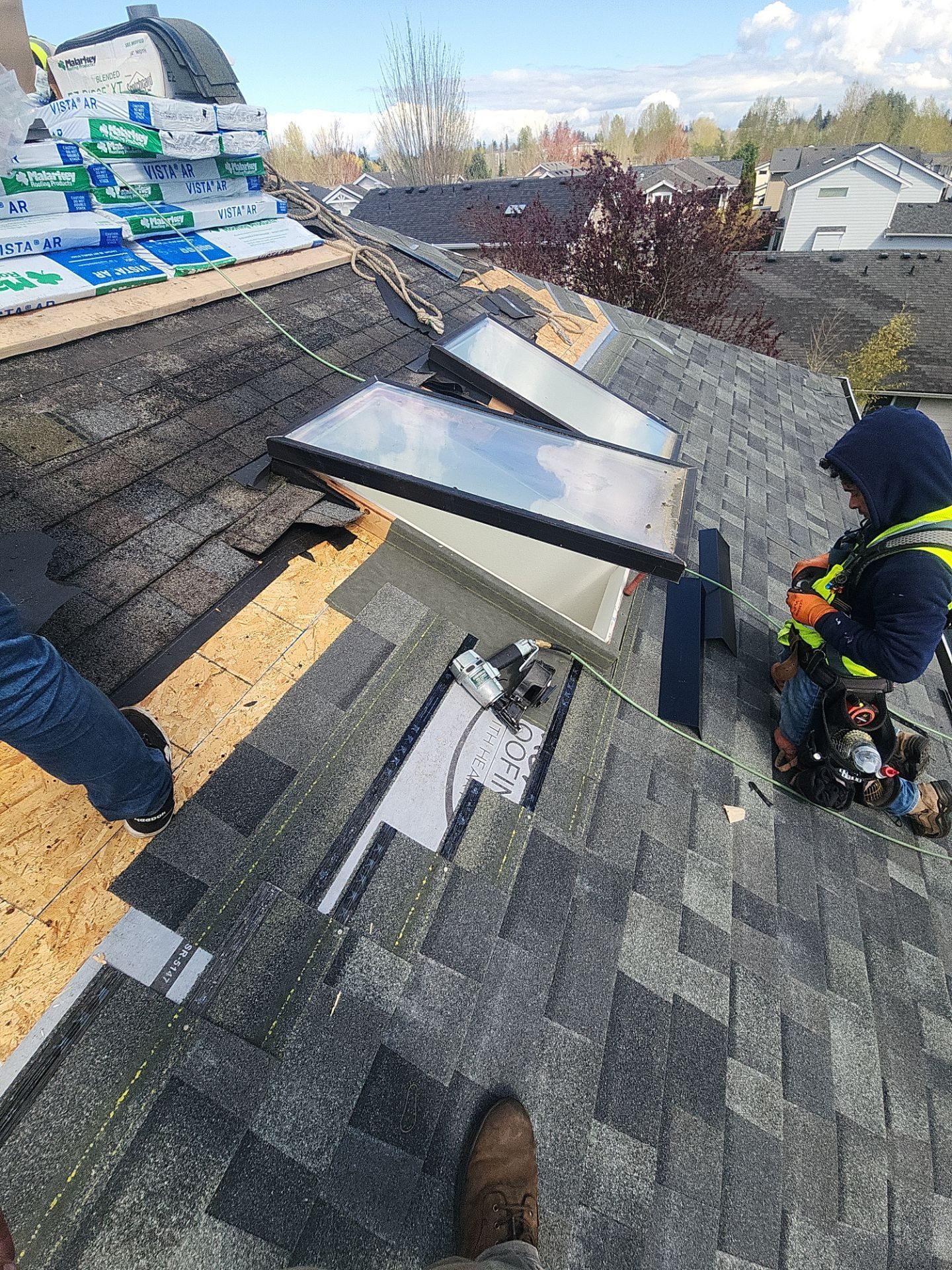 Aerial drone view of completed Storm Grey asphalt shingle roof on Mill Creek, WA home by Amor Roofing