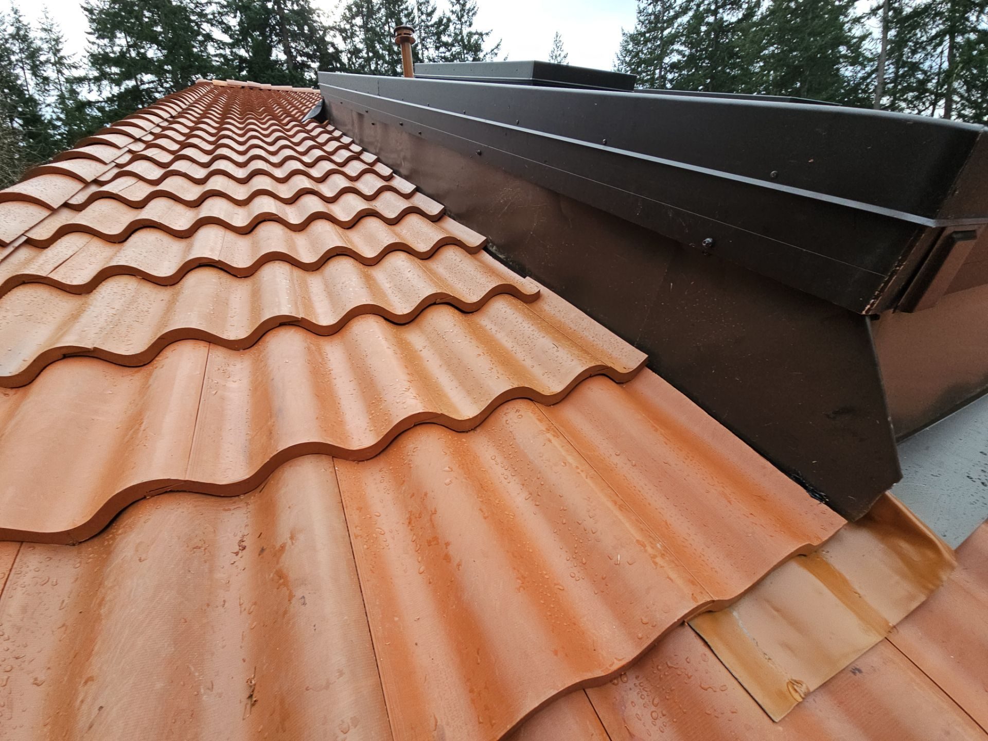 Detail of Antique Clay Brava Spanish barrel tile roof showing craftsmanship in Camano Island, WA