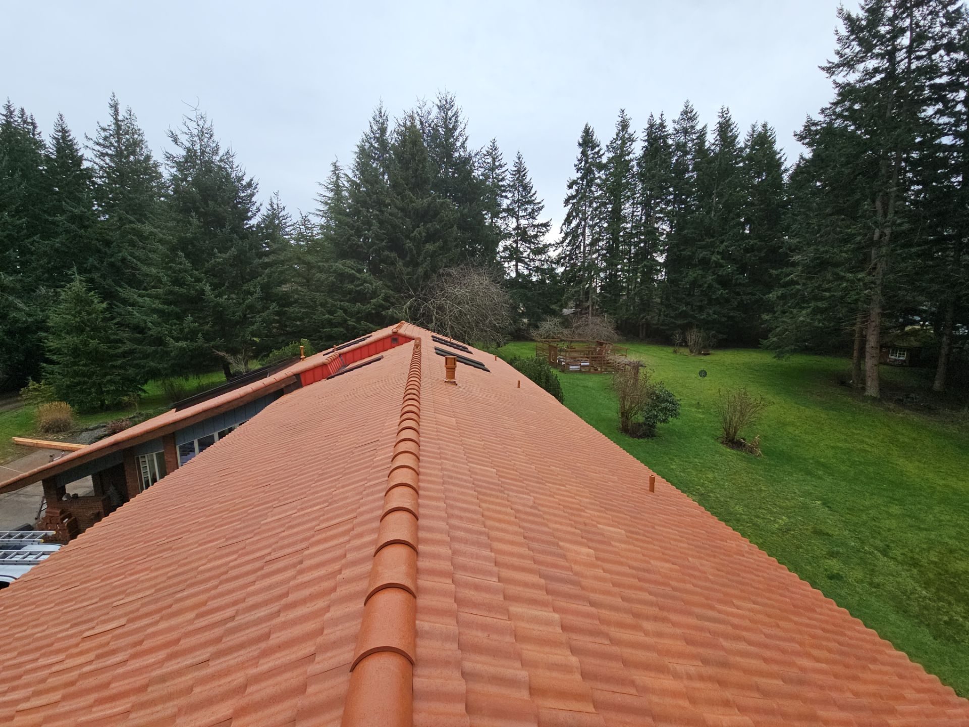 Close-up of Antique Clay Brava Spanish barrel tile roof finish in Camano Island, WA