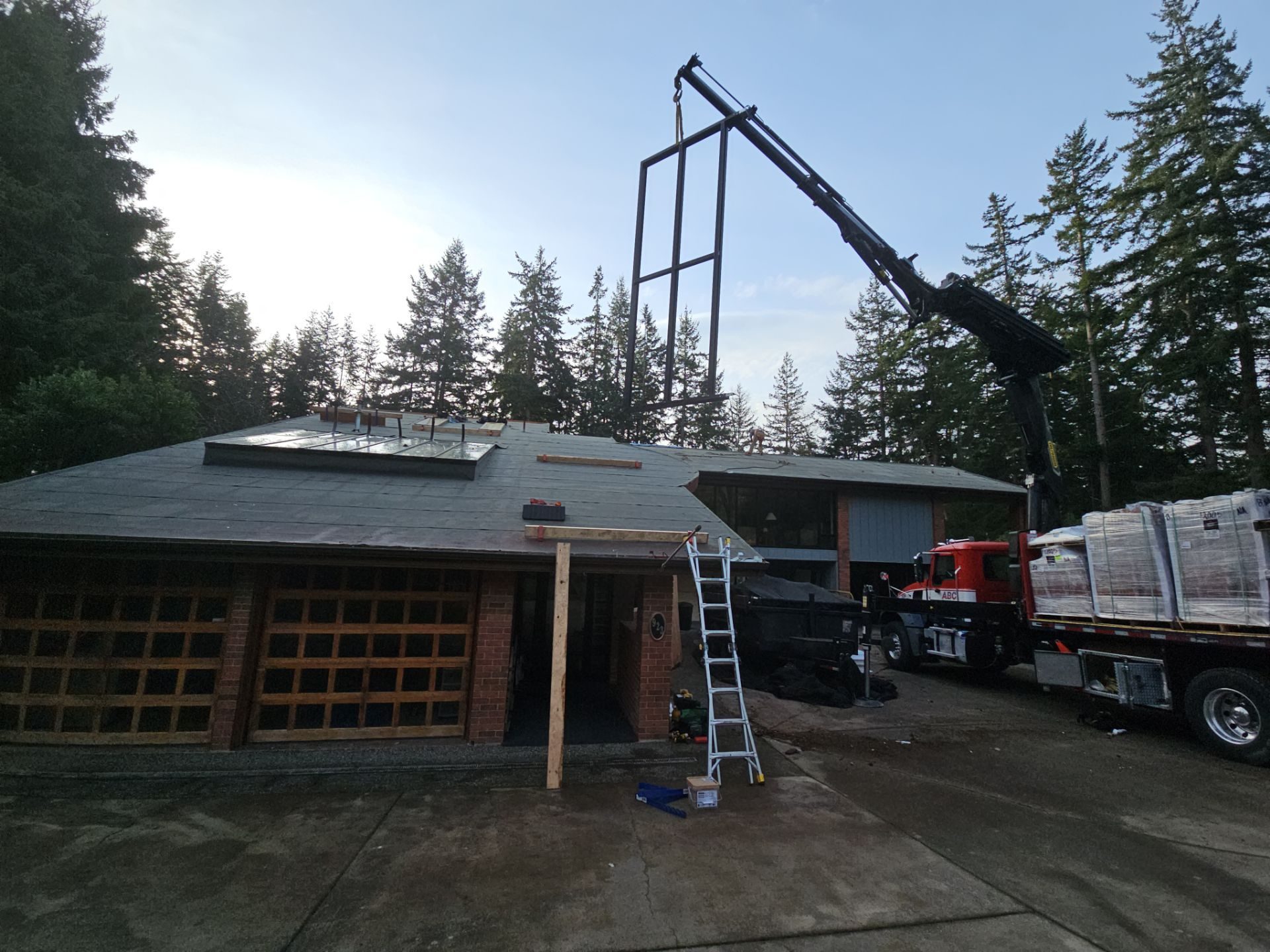Mid-installation view during Antique Clay Brava Spanish barrel tile roof project in Camano Island, WA