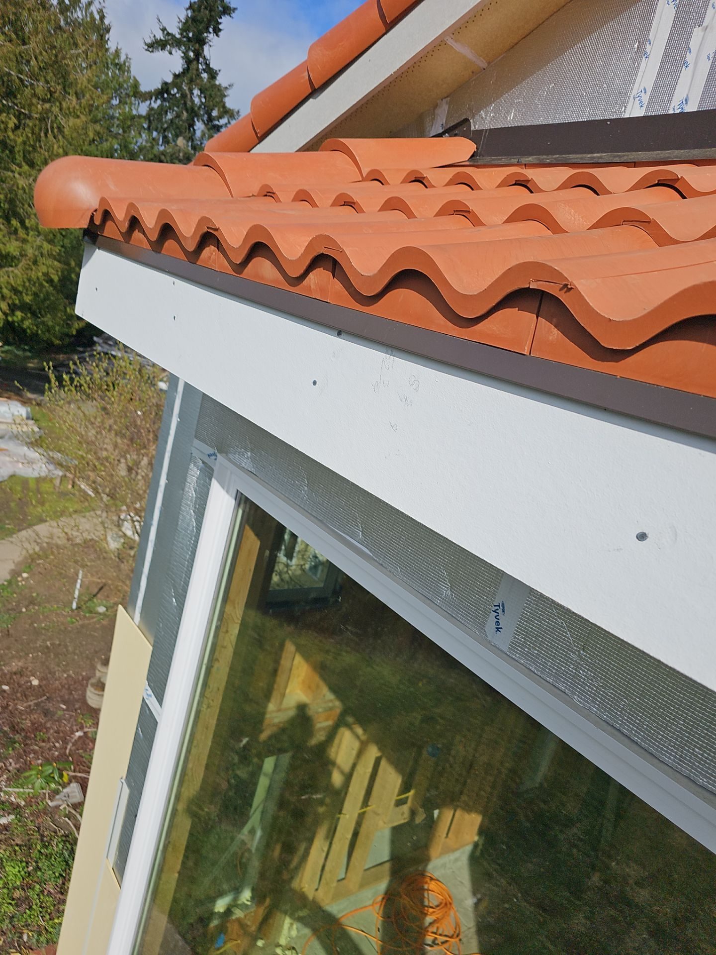 Antique Clay Brava Spanish barrel tile roof line and edge detail in Mukilteo, WA
