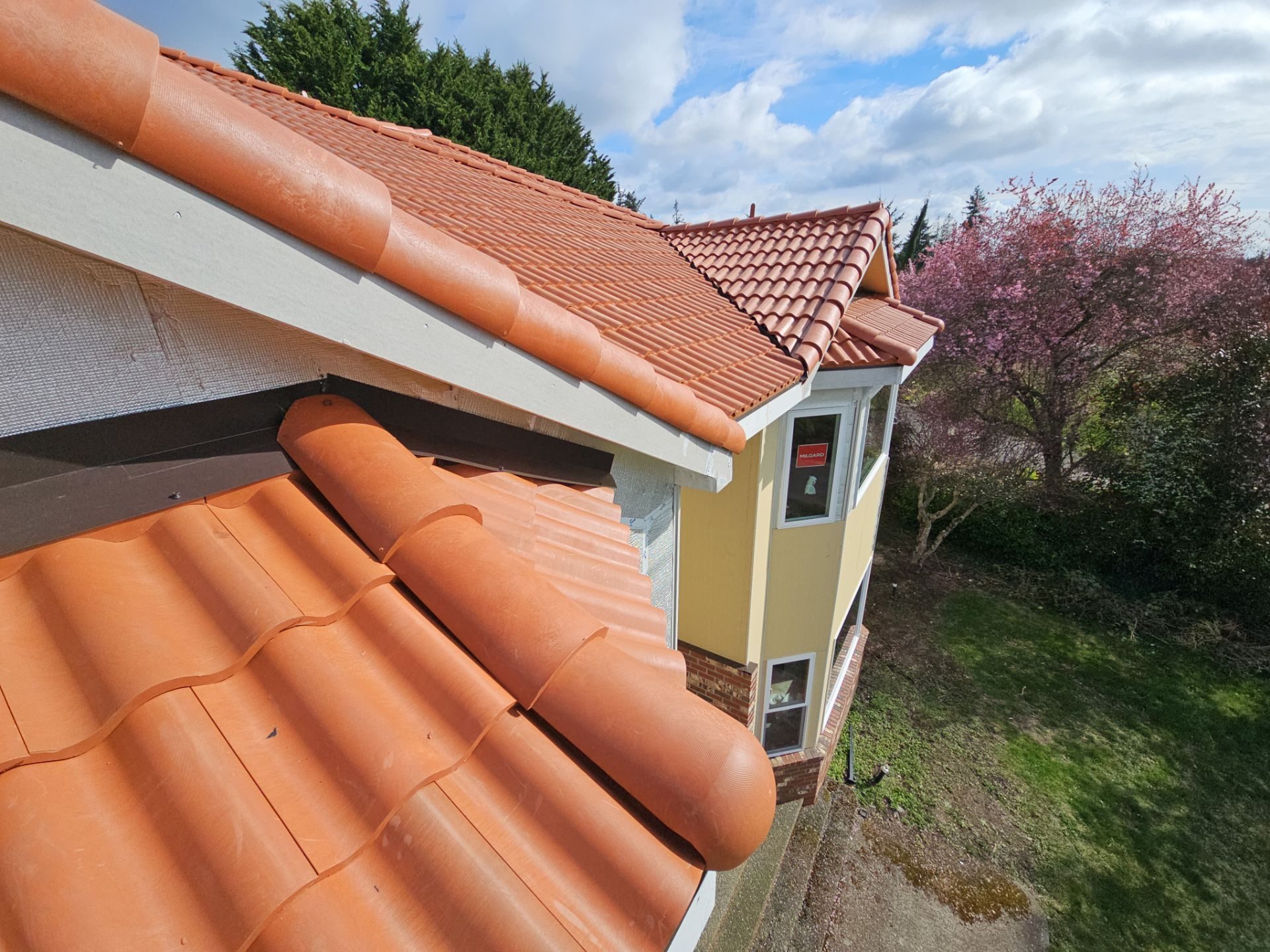 Roof plane detail showing Antique Clay Brava Spanish barrel tile pattern in Mukilteo, WA