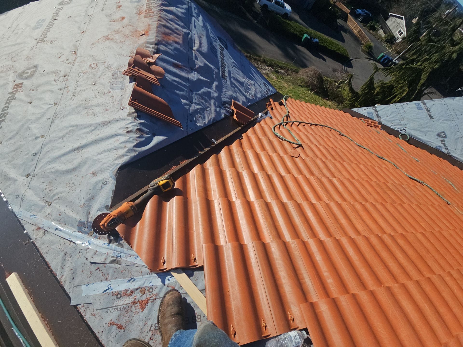 Mid-installation view during Antique Clay Brava Spanish barrel tile roof project in Mukilteo, WA