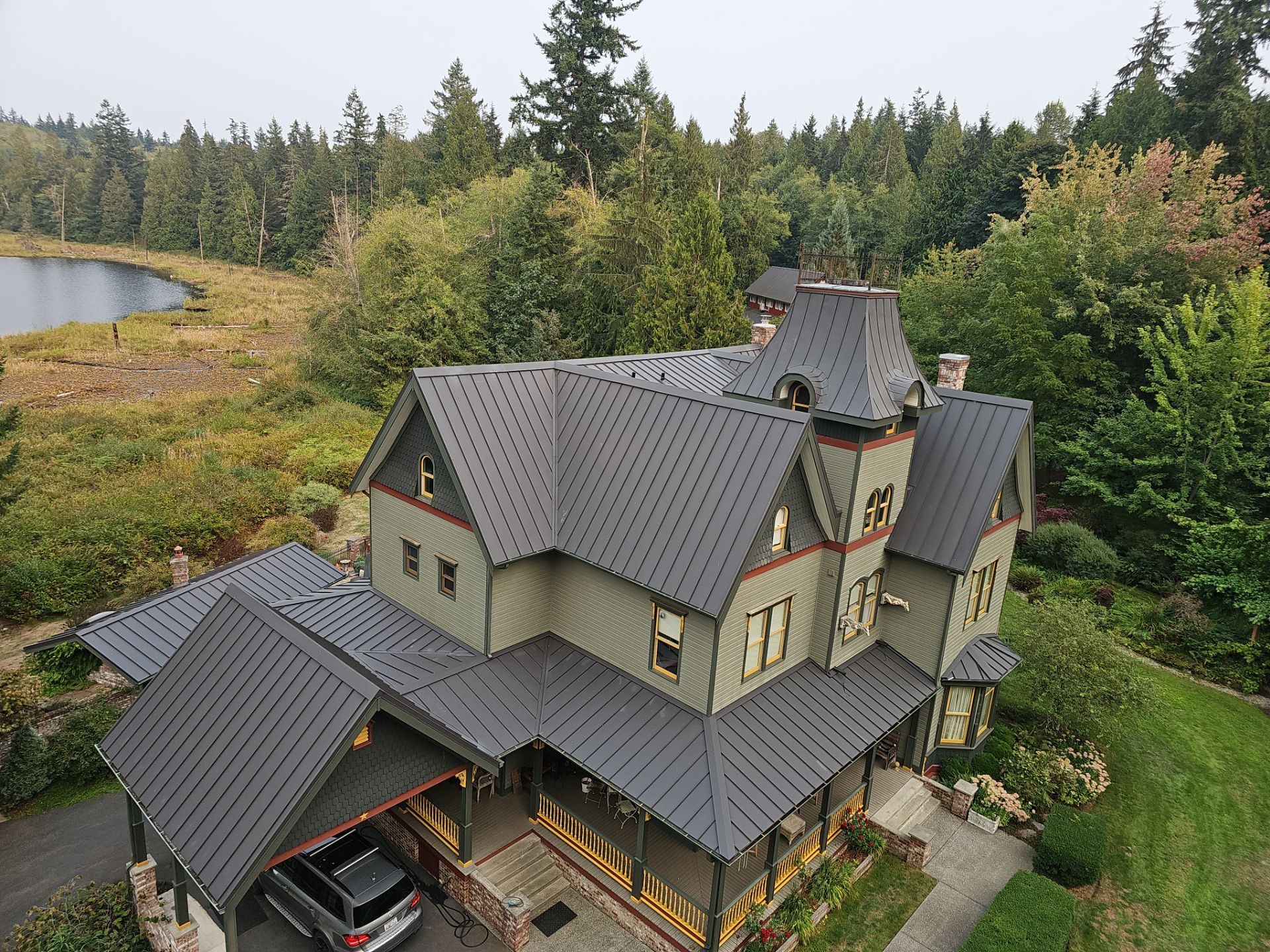Ground-level view of Black Carbon standing seam metal roof in Stanwood, WA