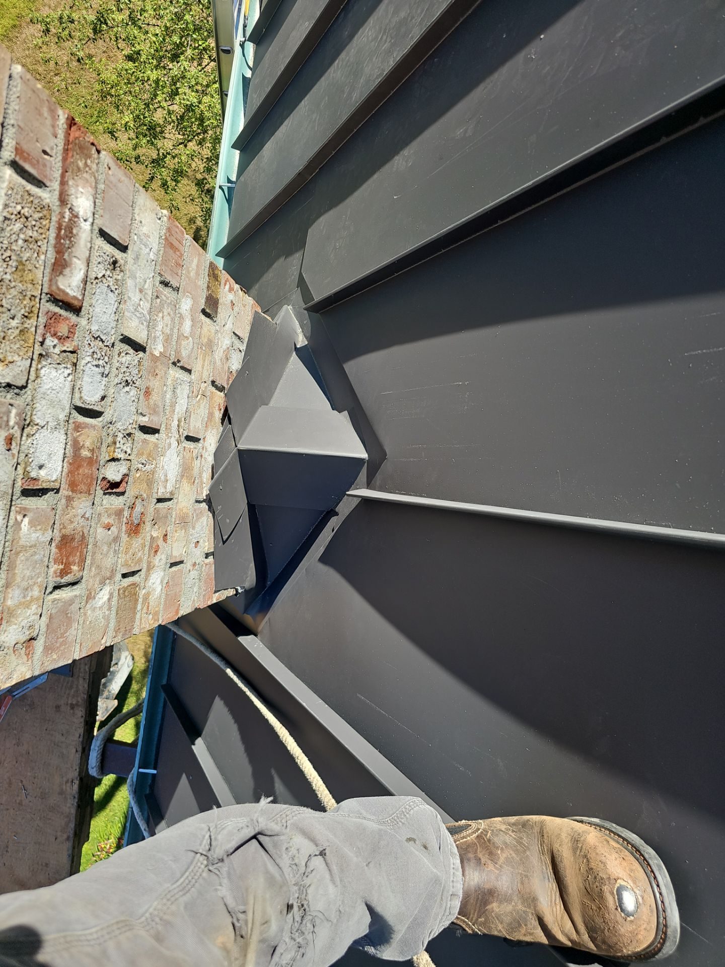 Amor Roofing site documentation: substrate preparation for Black Carbon standing seam metal install in Stanwood, WA