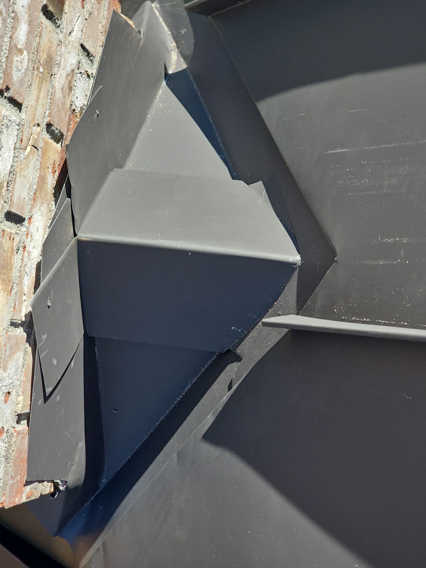 Mid-installation view during Black Carbon standing seam metal roof project in Stanwood, WA