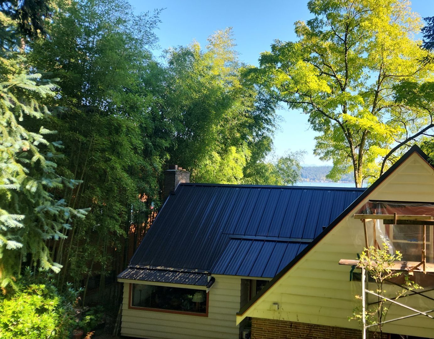Detail of Medium Bronze standing seam metal roof showing craftsmanship in Bellevue, WA