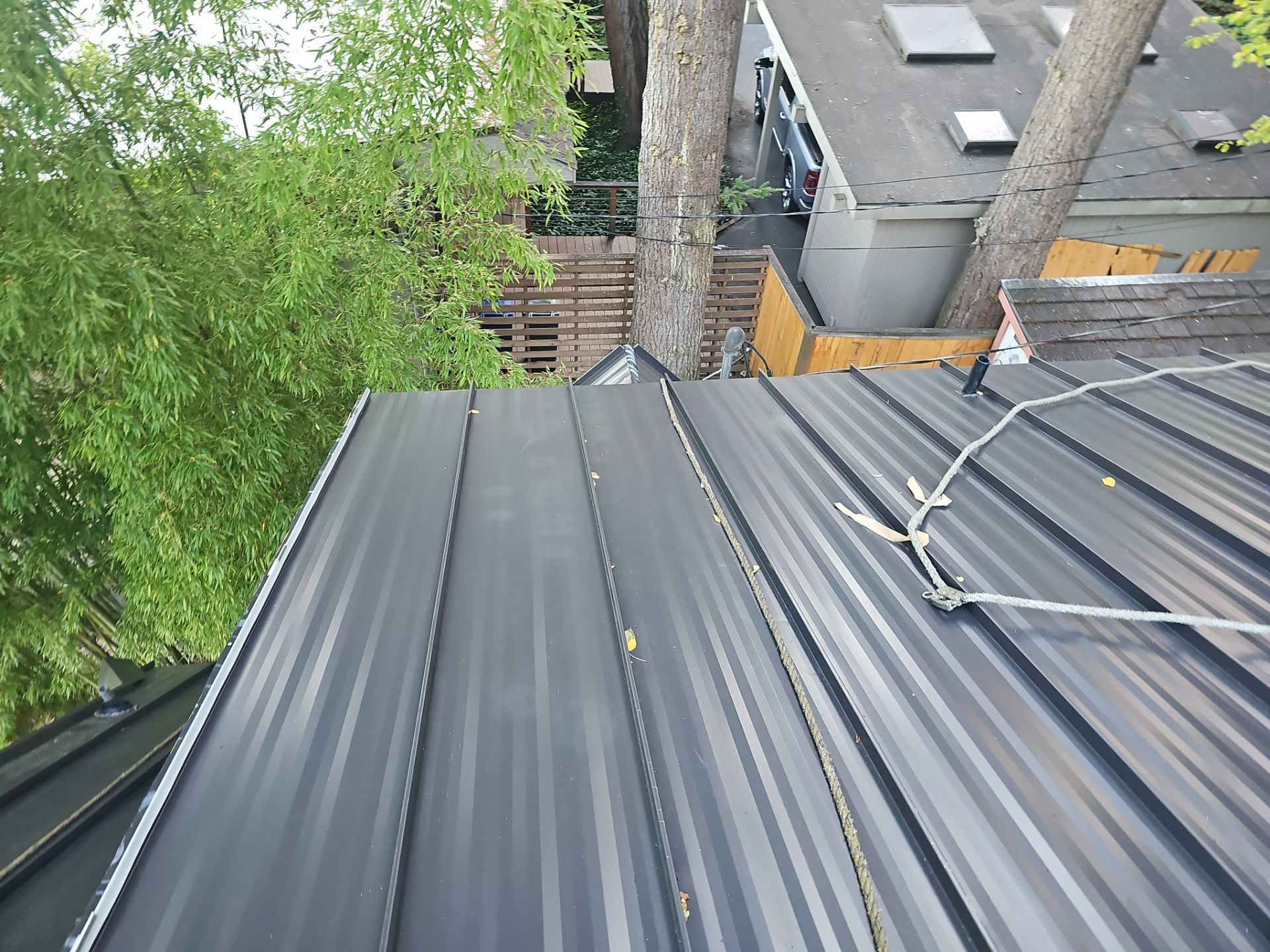 Close-up of Medium Bronze standing seam metal roof finish in Bellevue, WA