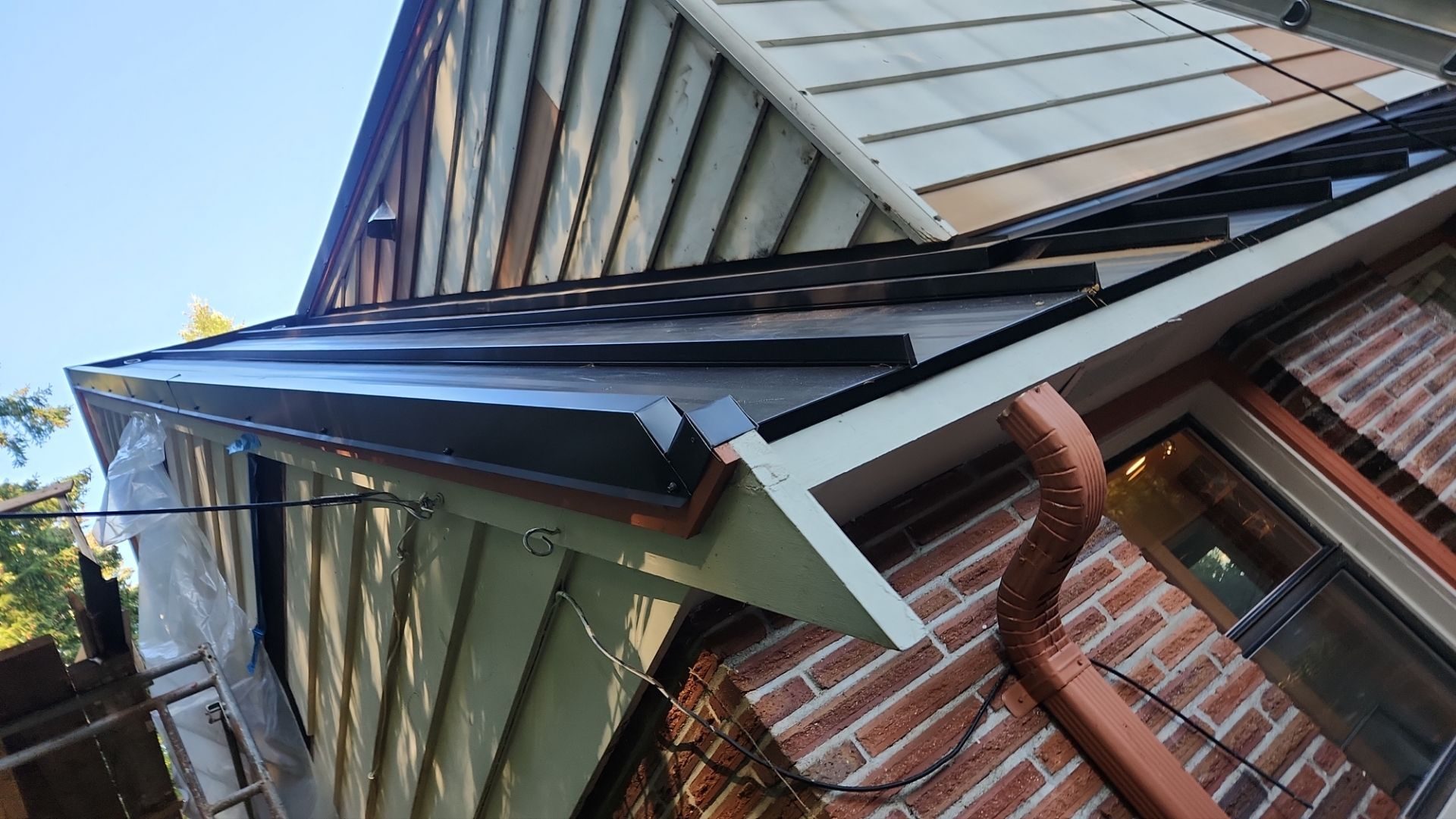 Aerial drone view of completed Medium Bronze standing seam metal roof on Bellevue, WA home by Amor Roofing