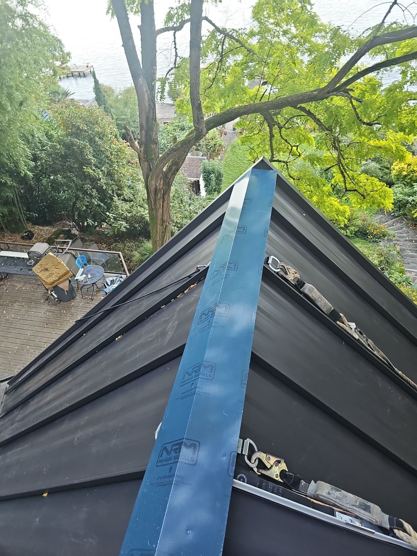 Amor Roofing site documentation: substrate preparation for Medium Bronze standing seam metal install in Bellevue, WA