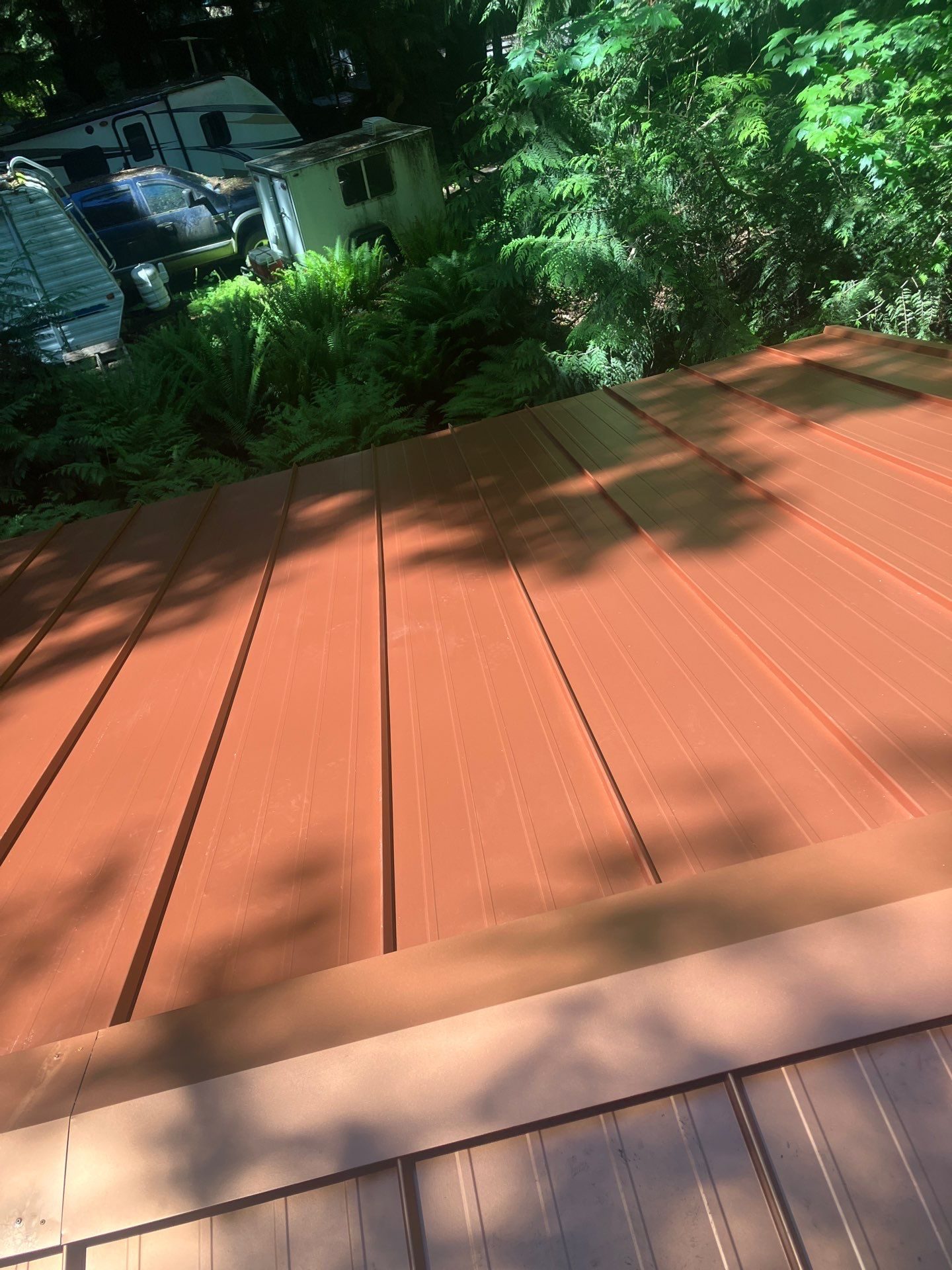 Copper Penny standing seam metal roof installation on Marysville, WA home, full property context