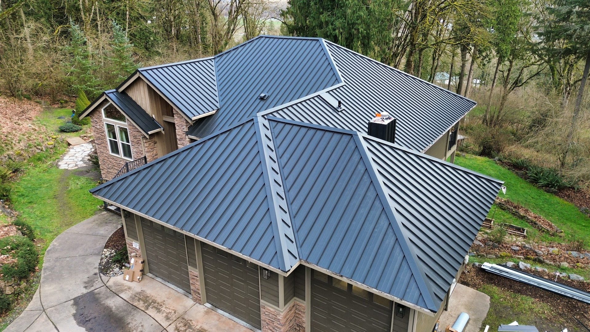 Matte Black standing seam metal roof installation on Snohomish, WA home, full property context