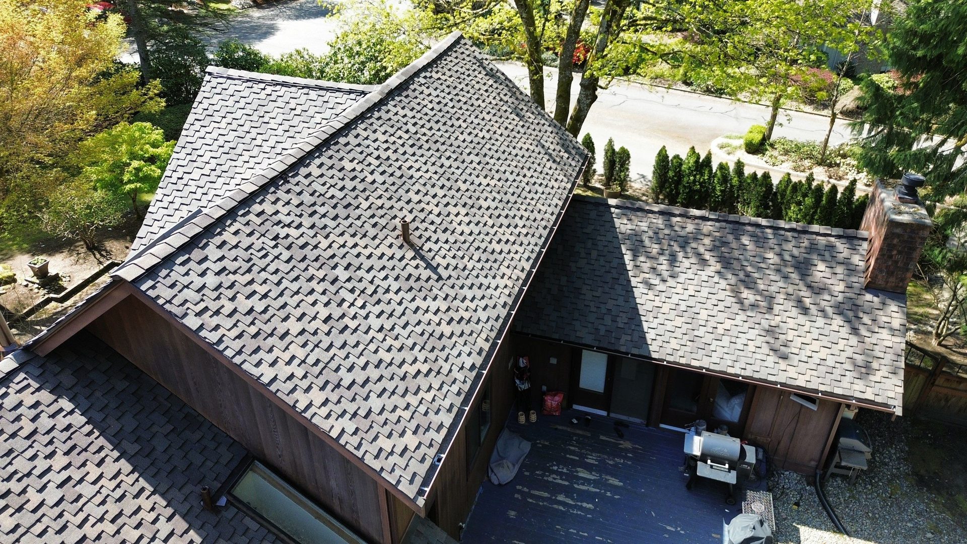Aerial drone view of completed Autumn Blend CertainTeed Presidential asphalt shingle roof on Mill Creek, WA home by Amor Roofing