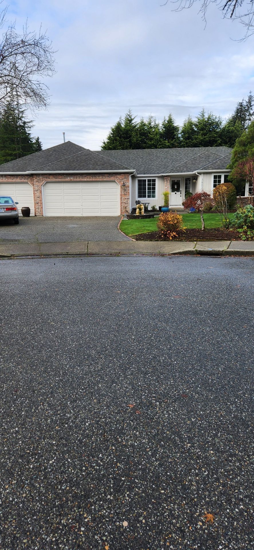 Aerial drone view of completed Midnight Black CertainTeed Presidential asphalt shingle roof on Brier, WA home by Amor Roofing