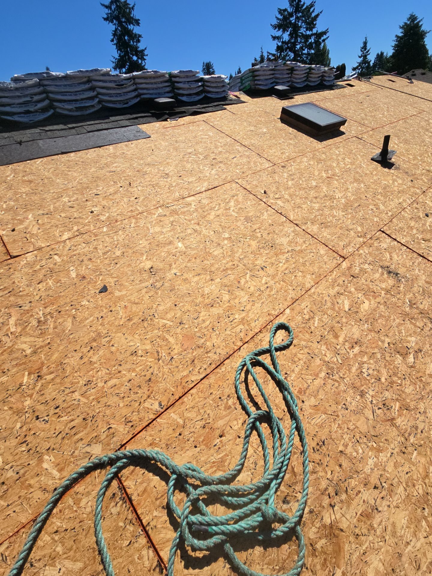 Mid-installation view during Midnight Black CertainTeed Presidential asphalt shingle roof project in Brier, WA