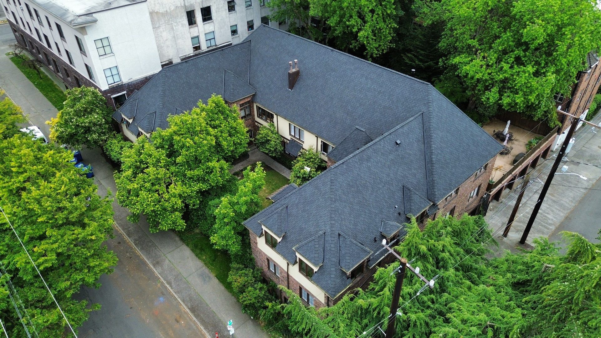 Charcoal CertainTeed Presidential Shake asphalt shingle roof installation on Seattle, WA home, full property context