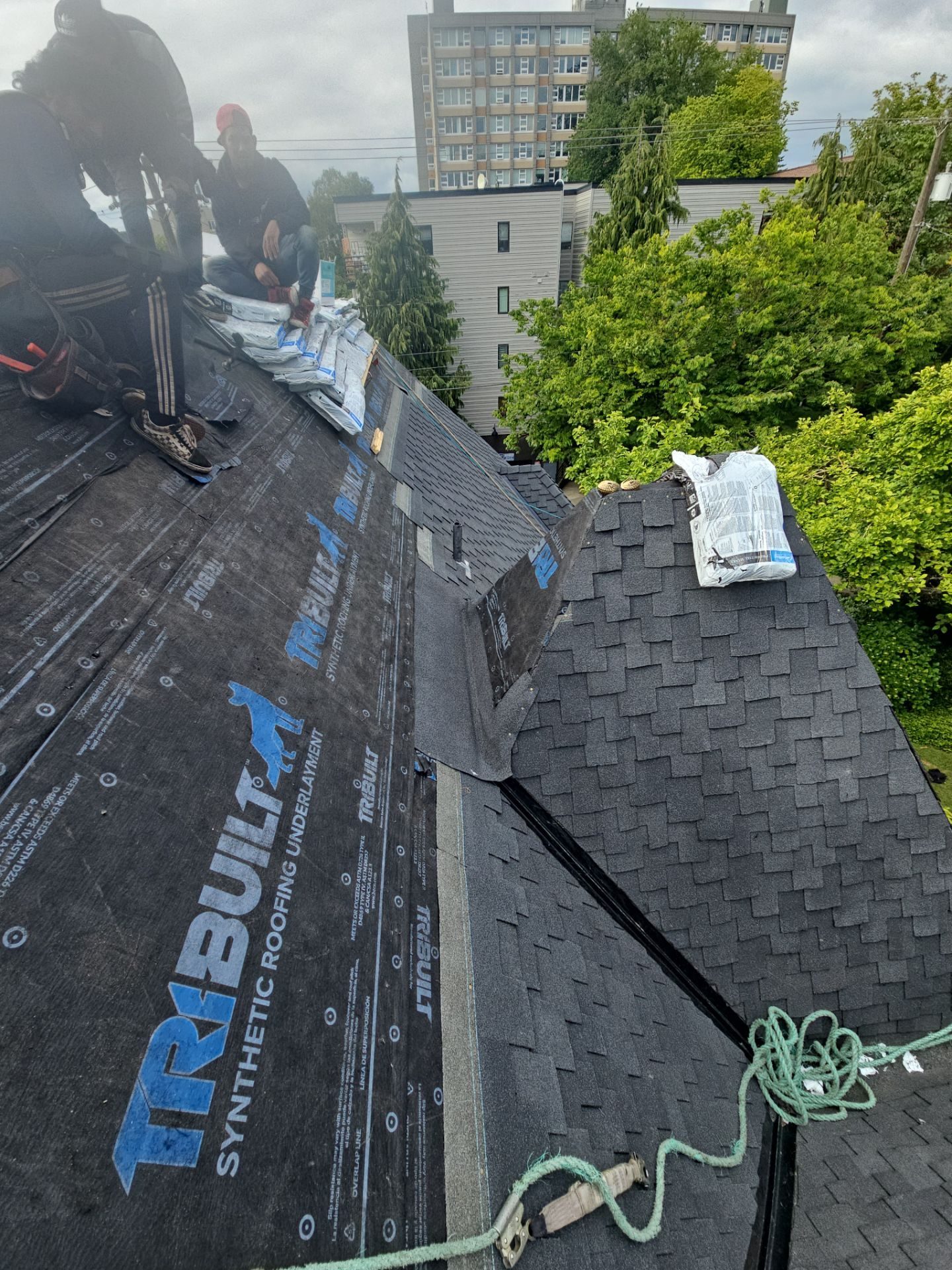 Tear-off and substrate exposure during Charcoal CertainTeed Presidential Shake asphalt shingle install in Seattle, WA
