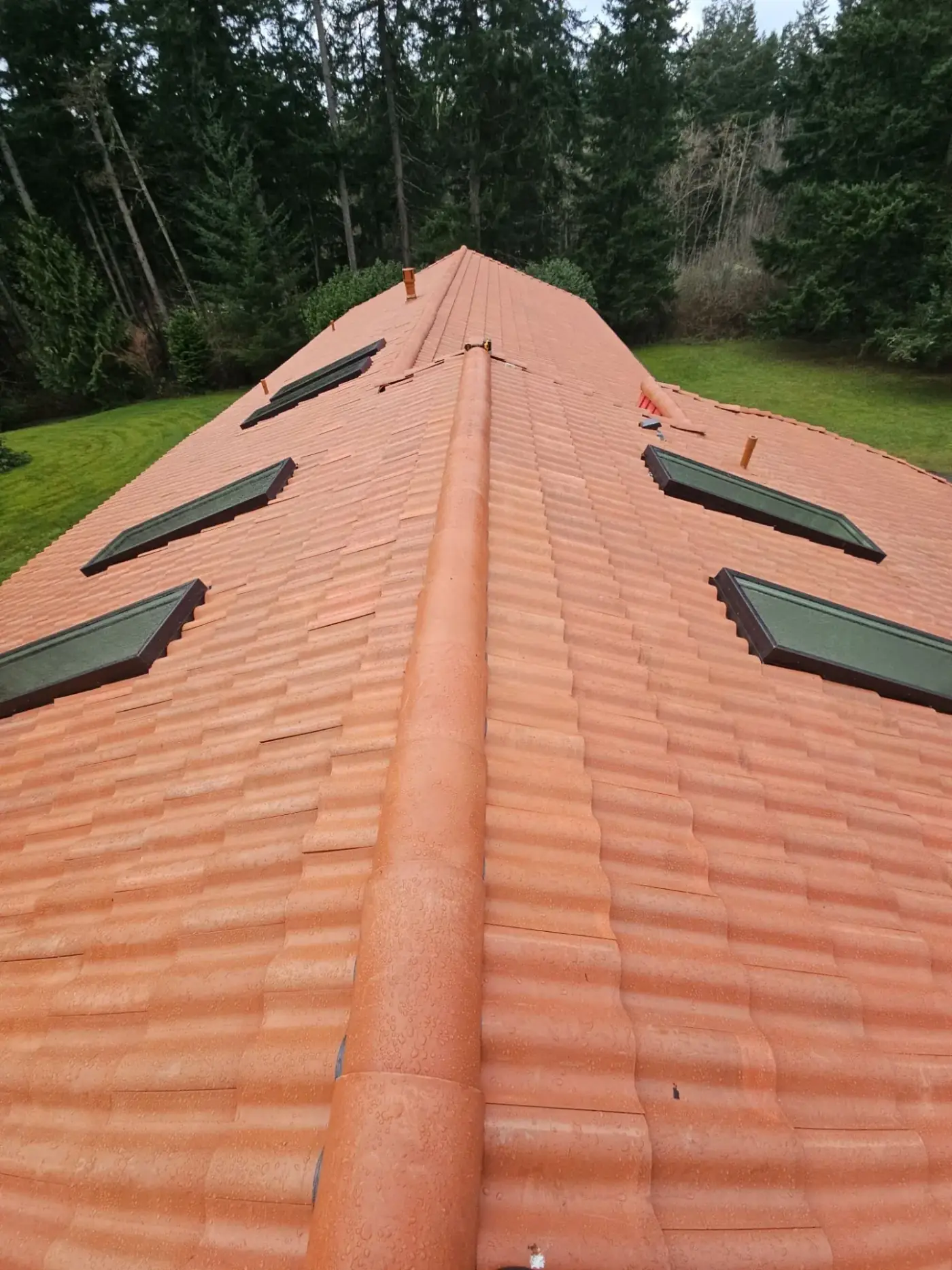Brava composite Spanish tile in antique clay on a Camano Island home by Amor Roofing