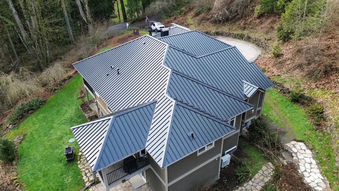 Drone aerial showing gutter-to-metal-roof edge detail, Snohomish