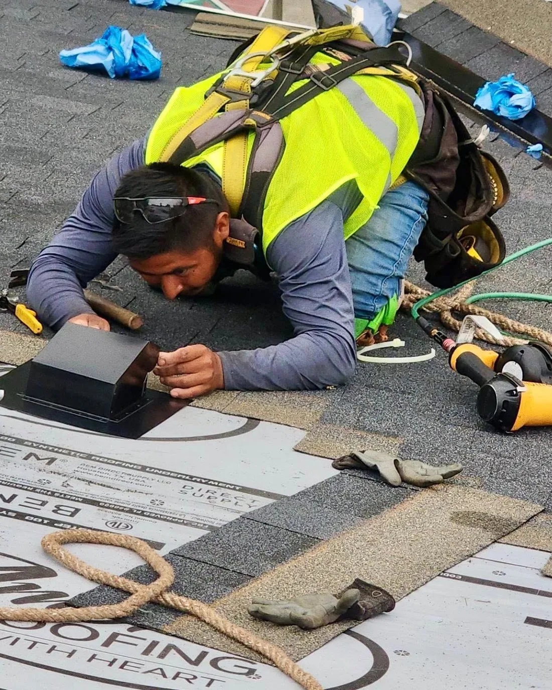 Amor Roofing installer doing detailed, meticulous roof replacement work
