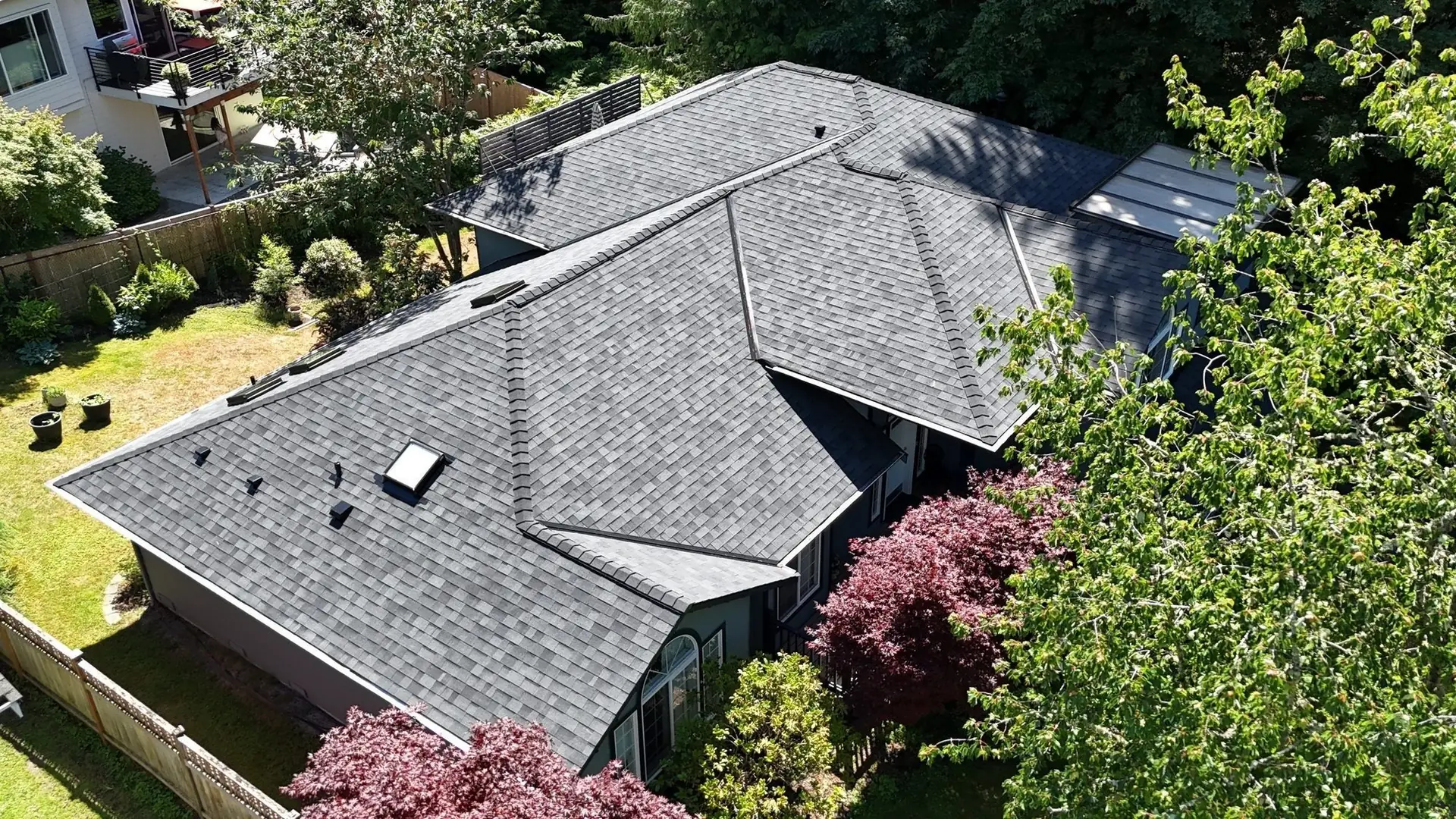 Aerial view of a new midnight black shingle roof on an Edmonds, Washington home