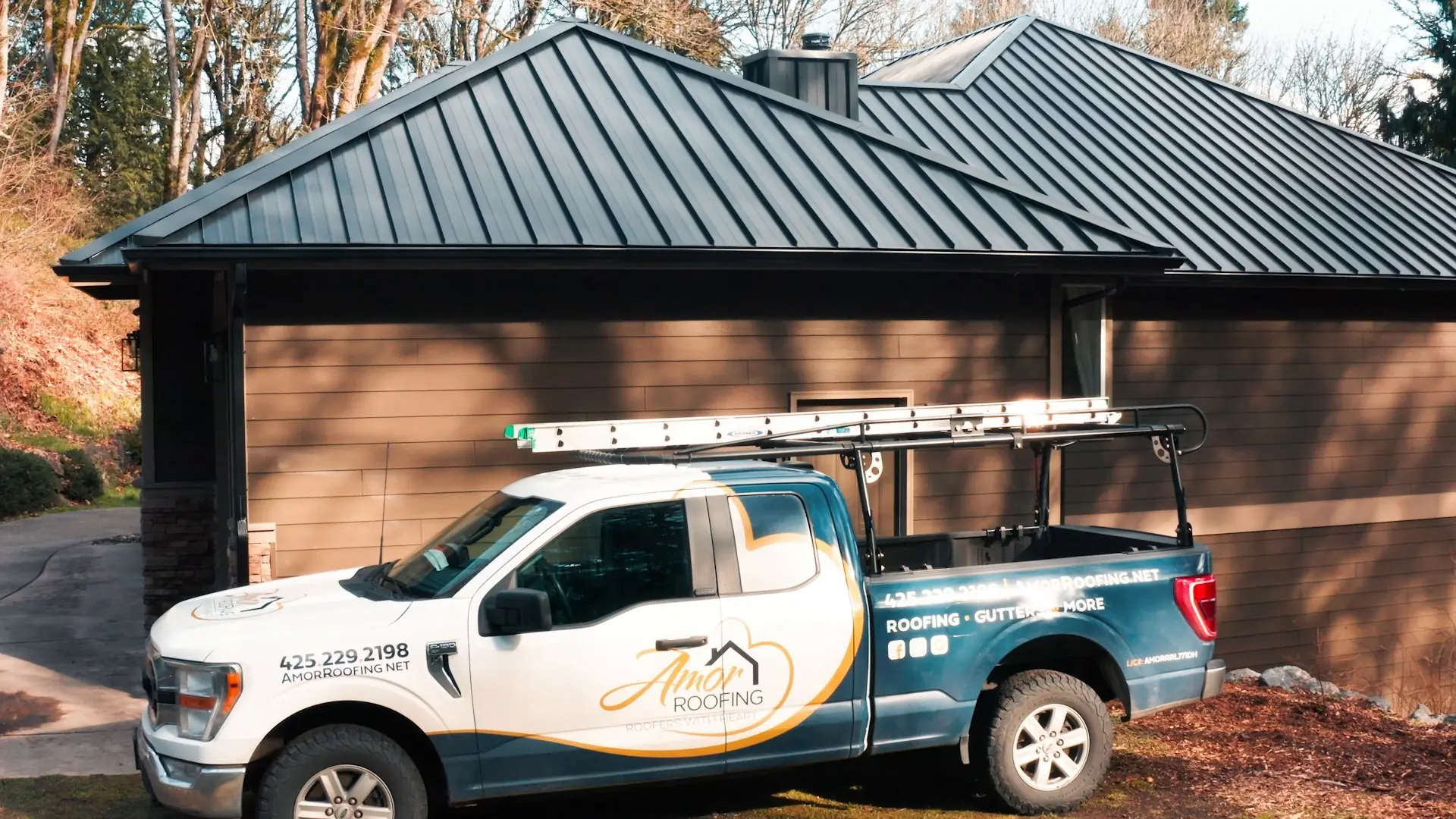 Amor Roofing truck outside a Snohomish, Washington home with a new standing seam metal roof