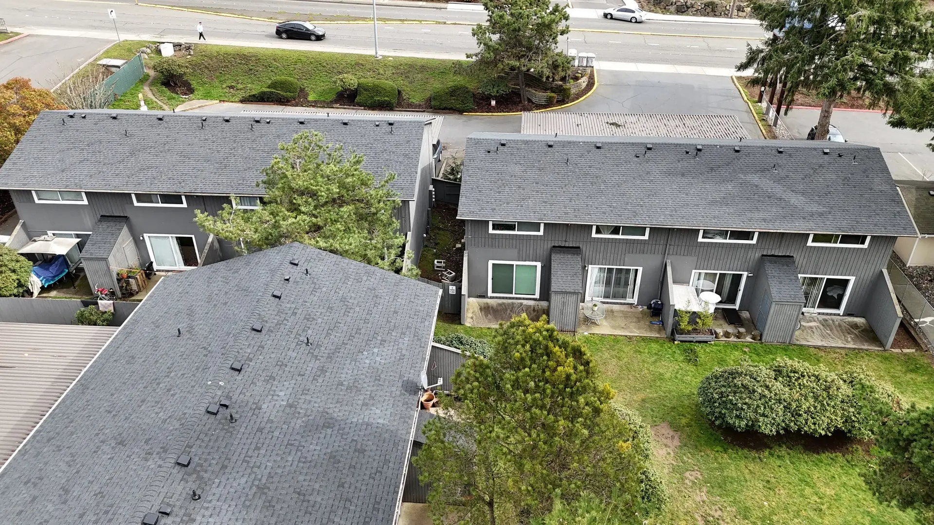 Aerial view of new asphalt shingle roofs on The Ridge apartments in Kent, Washington, installed by Amor Roofing